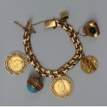 A Spanish yellow metal charm bracelet set numerous charms including a cottage, handbag, cupid,