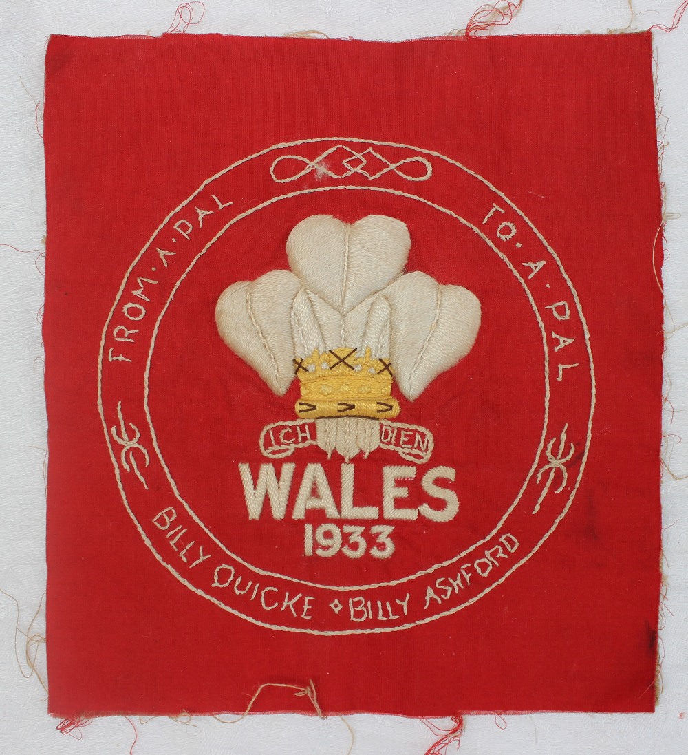 A tapestry panel embroidered with The Prince of Wales Feathers above "Wales 1933",