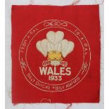 A tapestry panel embroidered with The Prince of Wales Feathers above "Wales 1933",