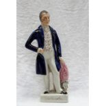 A 19th century Staffordshire figure of Wellington, in a blue frock coat on a D shaped base,