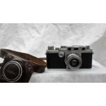 A Leica Ernst Leitz Wetzlar IIIf camera, with a black body and Leitz Elmar f=5cm 1:3,5 lens, No.