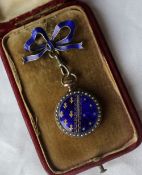 A French white metal, enamel and seed pearl decorated fob watch,