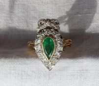 An emerald and diamond ring of heart shape,