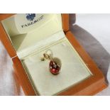 Victor Mayer for Faberge an 18ct gold, diamond and red enamel egg shaped pendant,
