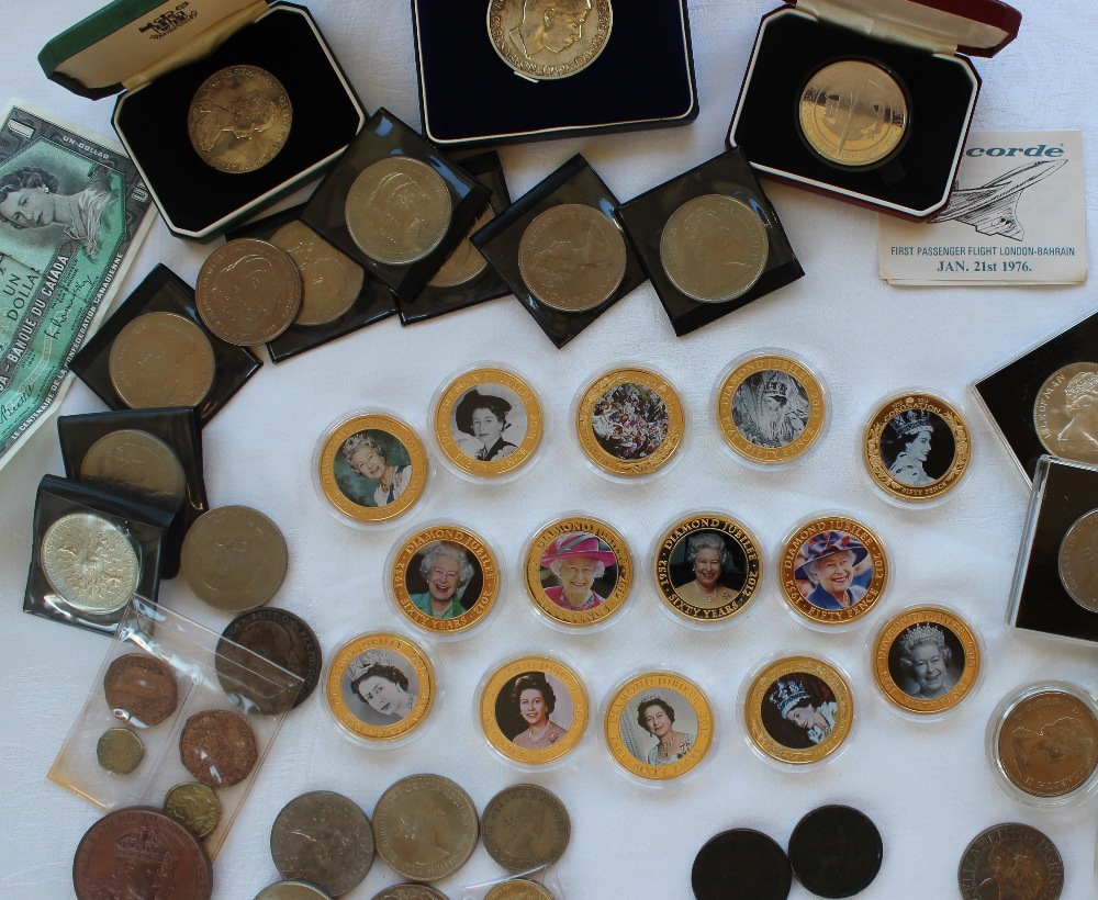 A large collection of coins including Elizabeth II crowns, Churchill crowns,