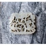 A white jade panel carved with birds and leaves, 4cm x 3.