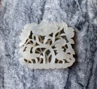 A white jade panel carved with birds and leaves, 4cm x 3.