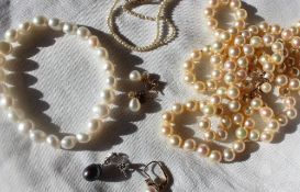 A pearl necklace set with 116 regular pearls to a 9ct yellow gold setting and clasp together with a