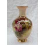 A Royal Worcester porcelain baluster vase painted with roses and leaves to a blush ivory ground,