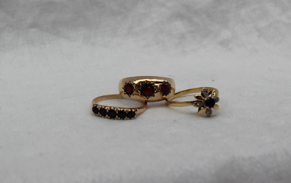 A 9ct gold garnet set gypsy ring,