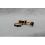 A 9ct gold garnet set gypsy ring,