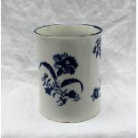 An 18th century Worcester blue and white waisted mug, decorated with flower sprays,