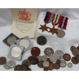 A set of three World War II medals including The 1939-1945 Star, The Italy Star and the War medal,