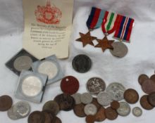A set of three World War II medals including The 1939-1945 Star, The Italy Star and the War medal,