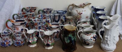 A collection of Masons stoneware jugs,