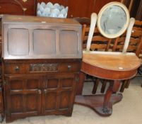 A 20th century oak bureau, with a panelled drop front,