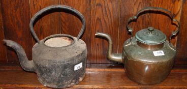 A copper kettle and a cast iron kettle