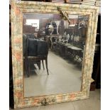 A large wall mirror decorated with printed flowers