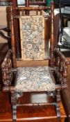 A child's American rocking chair with upholstered back and seat