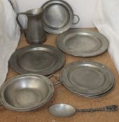 A collection of "Tin Exclusief" plates, bowls,