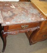 A marble topped side table with a square top above a frieze drawer on cabriole legs and scrolling