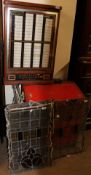 A collection of leaded glass panels together with a jukebox