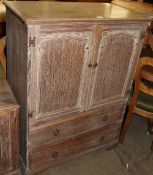 A limed oak tall boy together with a matching bedside cabinet