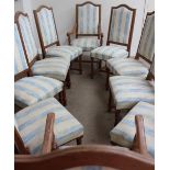 A set of ten 20th century oak dining chairs with pad seats and back on turned legs united by an H