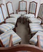 A set of ten 20th century oak dining chairs with pad seats and back on turned legs united by an H