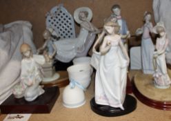 Seven assorted Lladro figures, including a girl on a chaise longue, girls with flowers,