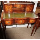 A reproduction mahogany ladies writing table with a raised superstructure above a leather writing