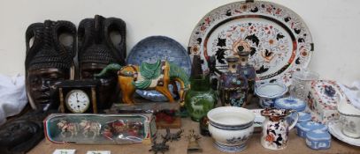 A 20th century Tang style horse together with cloisonné vases, carved African masks, carved figures,