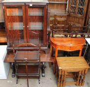 A Stag bookcase together with an oak coffee table, a folding oak cake stand,