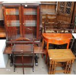 A Stag bookcase together with an oak coffee table, a folding oak cake stand,