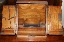 An Edwardian oak table top stationery cabinet