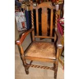 A 20th century oak elbow chair