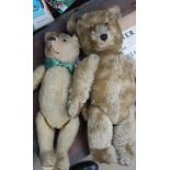 An English Mohair teddy bear together with other teddy bears and dolls