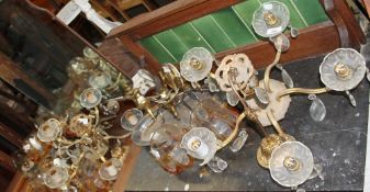 A brass five branch chandelier together with other chandeliers, wall lights, hardstone owl,