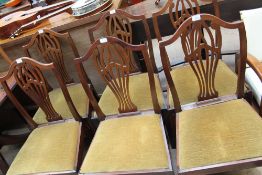 A set of six George III style mahogany dining chairs with a pierced vase splat together with a pair