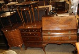 A 20th century burr walnut bureau together with a nest of two walnut tables,