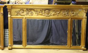 A matched pair of modern gilt overmantel wall mirrors together with another gilt overmantel mirror