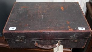 A leather suitcase with a lined interior