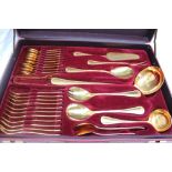 A Solingen gold plated flatware service, with a beaded edge and a place setting for twelve,