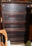 An oak four section bookcase with glass up and over doors