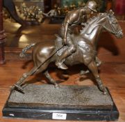 Milo A bronze model of a polo player on a bronze or marble base