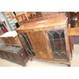 A 20th century mahogany display cabinet together with an oak coffer