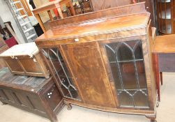 A 20th century mahogany display cabinet together with an oak coffer