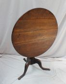 A 19th century oak tripod table,