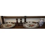 A pair of pottery meat plates together with a blue and white pottery vase and a pair of treen
