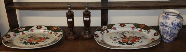 A pair of pottery meat plates together with a blue and white pottery vase and a pair of treen